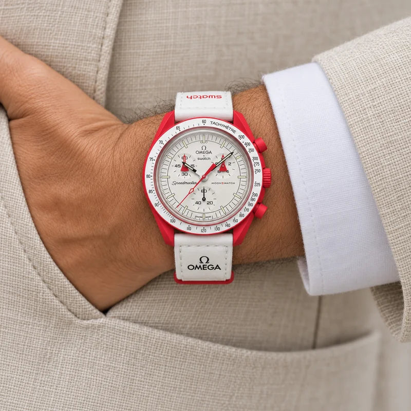 Illustrative render: Mission to Mars worn on the wrist with its strap (red case with a white dial and a white strap).